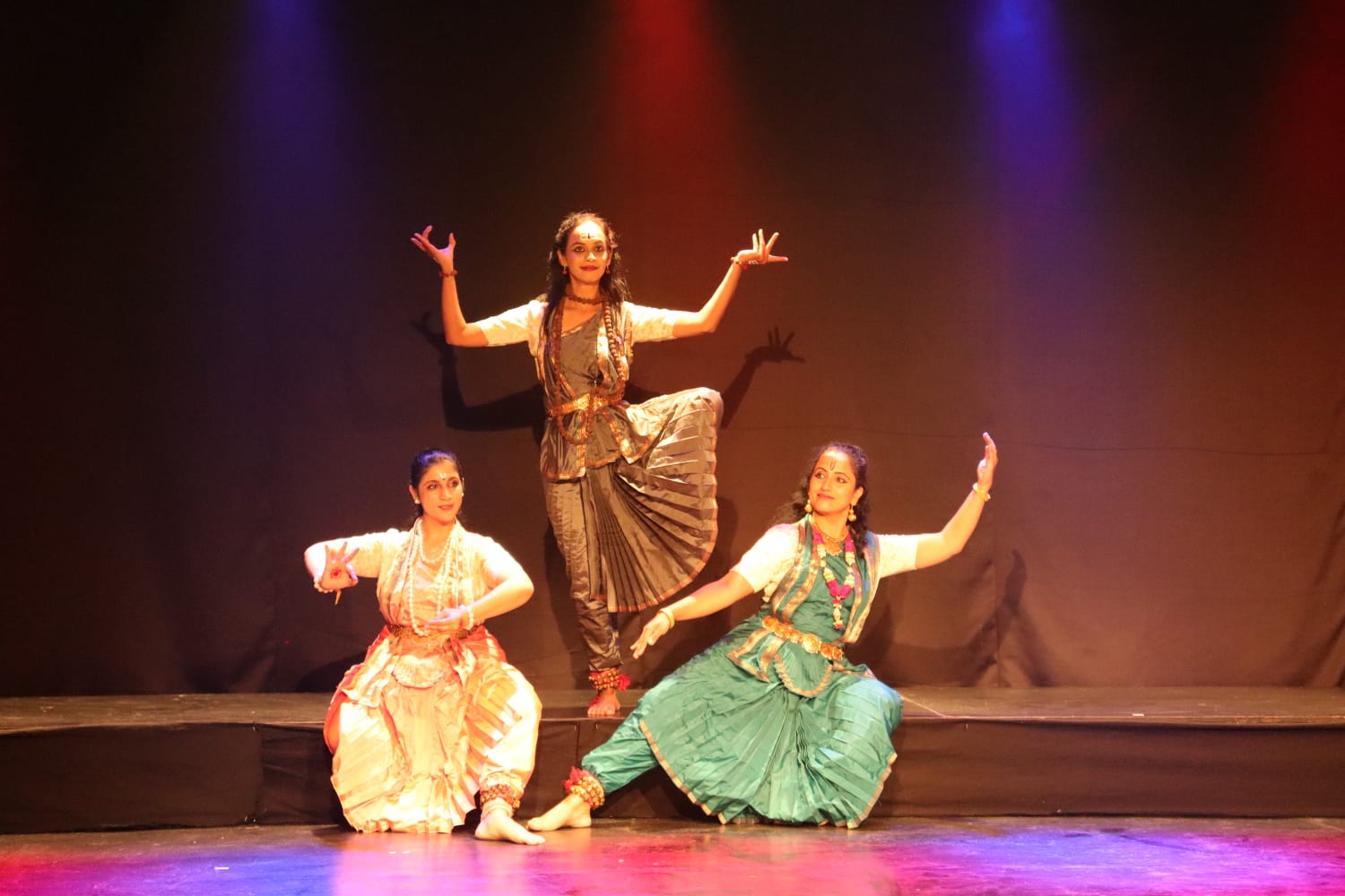 Young dancers posing in temple architecture